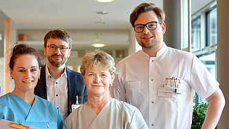 Mehrere Mitarbeiter in Berufskleidung